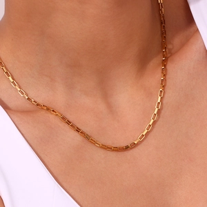 Detail of 18K gold-plated box chain necklace with minimalist geometric square links