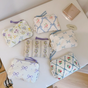 Floral cotton coin purses with colorful zippers in blue and purple pastoral patterns