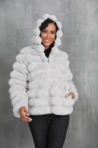 Macro detail of plush light gray faux fox fur hood and wavy segmented stitching on the coat