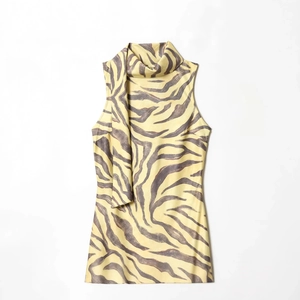 Elegant sleeveless zebra print dress featuring a scarf-neck collar and a smooth texture