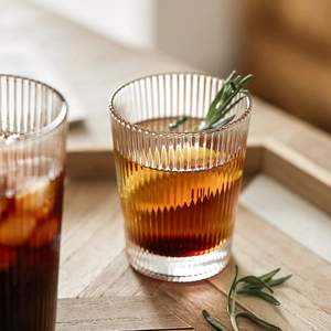 Ins style vertical ribbed glass cup for juice and coffee on a wooden tray