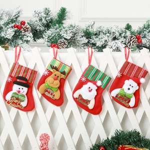 Close-up of four red Christmas stockings with 3D Santa, Snowman, Reindeer, and Bear motifs