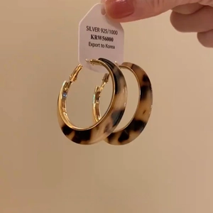 Vintage leopard print hoop earrings with gold metal accents and 925 silver posts