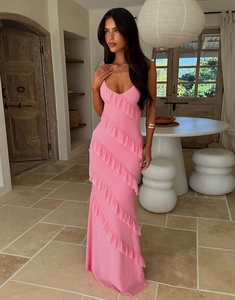 Detailed close-up of pink slim fit long dress with ruffles and backless spaghetti straps