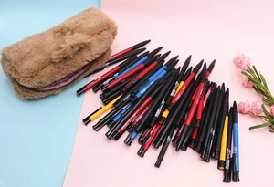Detail of a large capacity brown plush stationery bag with various colorful gel pens