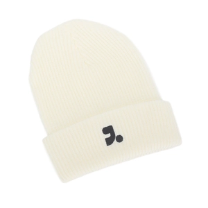 Detail of cream white ribbed knit beanie featuring a black embroidered logo on the cuff