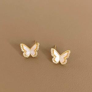 Minimalist butterfly stud earrings in gold with white mother of pearl and zircon stones