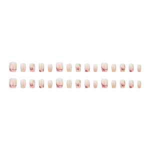 Press-on nail set featuring golden maple leaf designs and red floral patterns on nude base