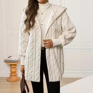Close-up of cream cable-knit texture and soft faux fur material on hooded cardigan
