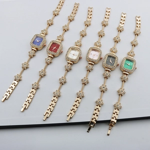 Detailed view of luxury quartz watches with flower-shaped rhinestone bracelets in six colors