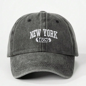 Close-up of New York 1625 embroidery on vintage washed cotton baseball cap texture