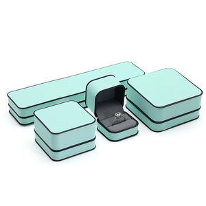 Premium mint green jewelry box set with black trim and grey velvet lining for rings