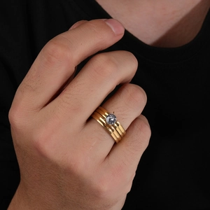 Gold layered titanium steel ring with round zircon gemstone on male hand