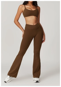 Detail of high-waisted yoga flare pants with a unique crossover V-shaped waistband design