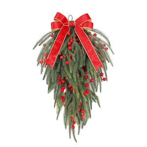 Christmas teardrop swag with red bow, green pine needles and festive berries on white background