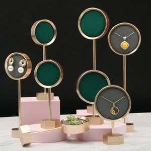 Detail of velvet padding and golden metal frame on the vintage hairpin display stand