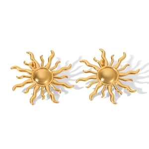 Detailed view of elegant gold sun-shaped stud earrings in polished stainless steel