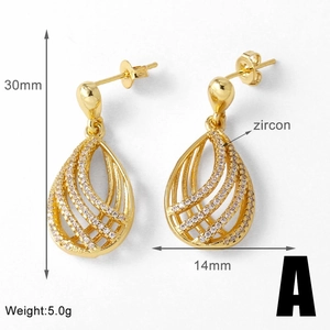 Detail view of heart-shaped gold drop earrings with zircon showing dimensions 30mm by 14mm