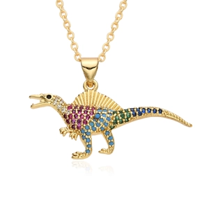 Macro shot of gold-plated Spinosaurus pendant with vibrant micro-set colorful zircons