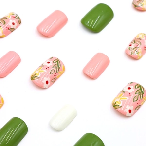 Floral oil painting press-on nails set with green and pink petal designs on white background