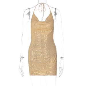 Close-up of sparkling gold sequins on the halter neck mini dress with V-neckline