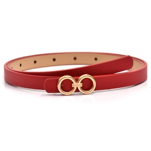 Detail of red thin leather belt with gold double-ring buckle on white background