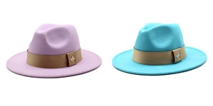 Detail of wool fedora hats in lavender and lake blue with brown bands and gold buckles