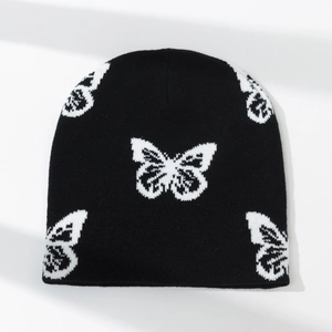 Winter knitted beanie with stylish white butterfly jacquard pattern in black