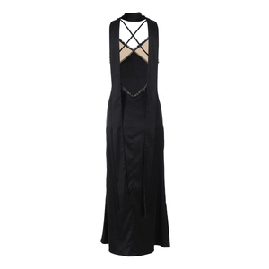 Detail of elegant black satin backless dress with lace patchwork and crisscross straps