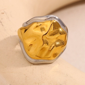 Detailed macro view of 18K gold plated snake-head ring with irregular lava texture