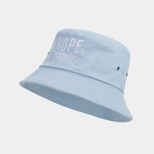 Detail of light blue cotton bucket hat with white embroidery 'NOPE. not today' slogan