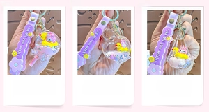 Close-up of liquid quicksand keychains with floating glitter and cartoon charms