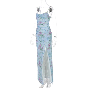 Detailed view of light blue floral dress with side ruching and a high slit feature