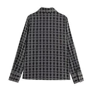 Detailed back view of women's shirt featuring black and white geometric oval patterns
