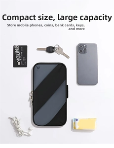 Flat lay of sports arm bag with phone keys and cards showing large storage capacity