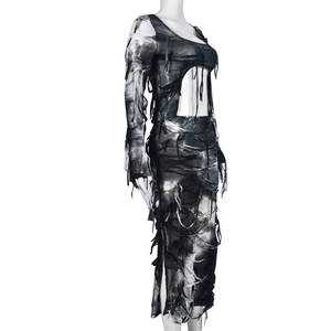 Close-up of tie-dye bodycon dress fabric featuring distressed ripped details and punk style