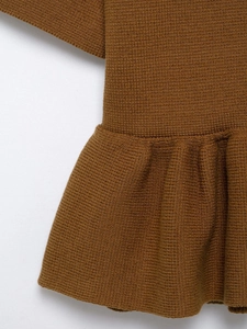 Close-up of the pleated hem and premium knit texture on this brown short sleeve top
