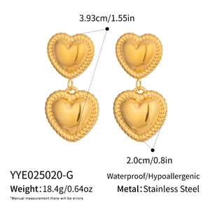 Detailed view of layered stainless steel heart earrings with textured twisted gold borders