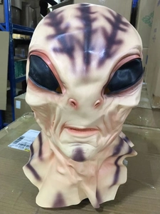 Detailed view of realistic latex alien mask with purple veins and black almond eyes