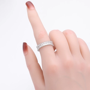 Macro shot of silver S925 ring with rectangular zircon stones on a model hand
