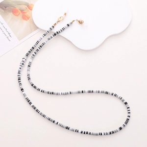 Detail of beaded glasses chain with white LOVE letter beads and secure metal clips