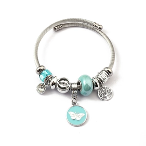 Close-up of steel twisted cable bracelet with turquoise crystal and tree of life charm