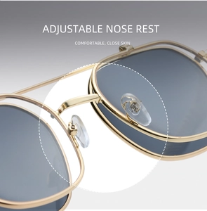 Close-up of adjustable metal nose pads on vintage punk style sunglasses for comfort