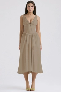 Close-up detail of khaki slim fit maxi dress with V-neckline and tie waist ribbon