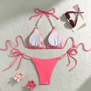 Detail of pink checkerboard bikini with pearl beads and removable circular pads