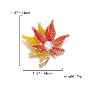Detailed view of maple leaf brooch with enamel colors, pearl center and size dimensions