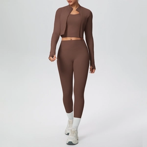 Detail view of deep brown yoga set featuring high-waist leggings and thumbhole sleeves