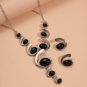 Vintage silver jewelry set with oval black stones including necklace and earrings
