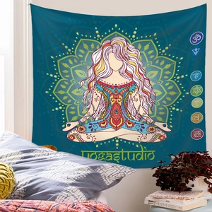 Detail view of a mandala yoga tapestry with chakra symbols on a bedroom wall