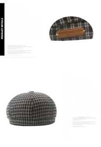 Detail view of plaid newsboy hat featuring a brown leather patch and adjustable buckle